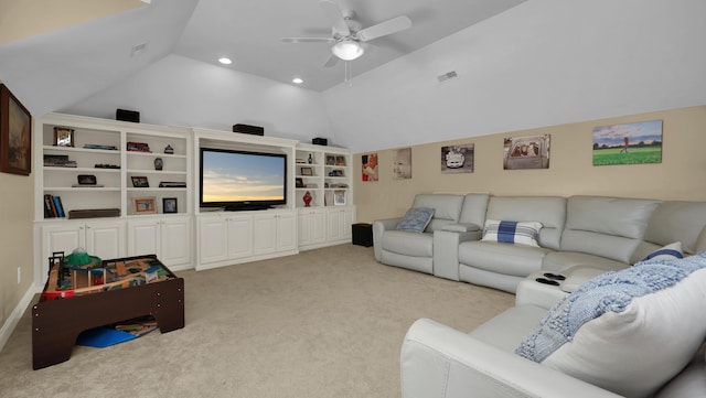 carpeted home theater room featuring ceiling fan and vaulted ceiling