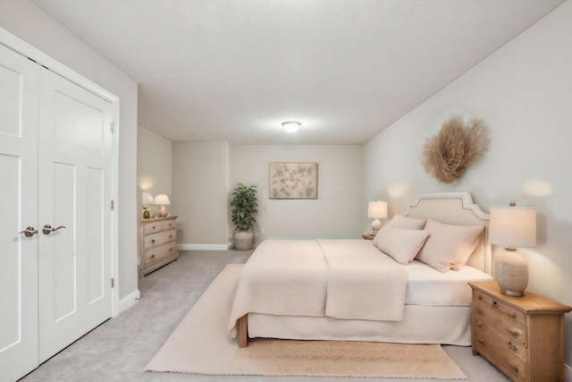 carpeted bedroom featuring a closet