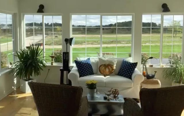 sunroom / solarium featuring a healthy amount of sunlight