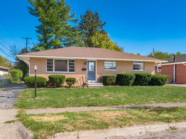 single story home featuring a front yard