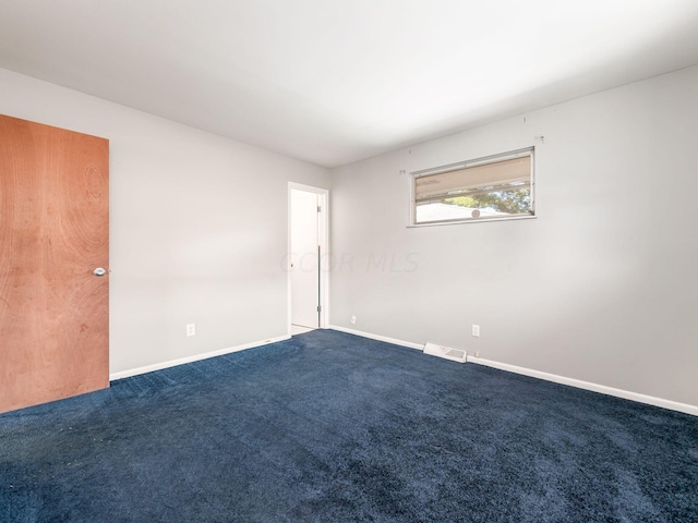 unfurnished room with carpet floors