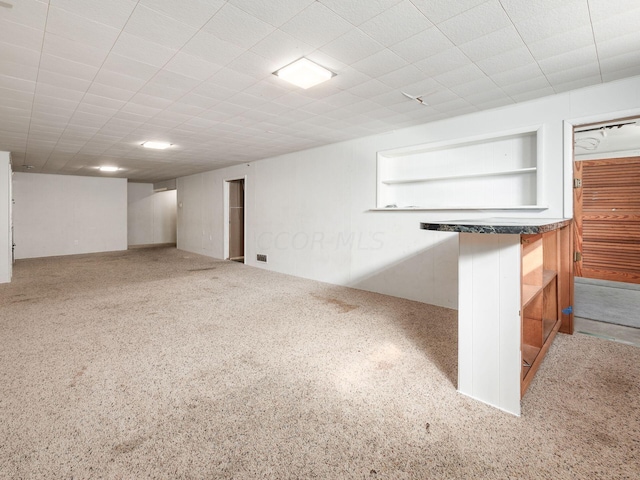 basement with carpet flooring