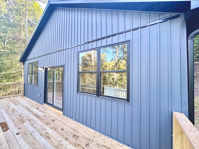 view of side of home with a wooden deck