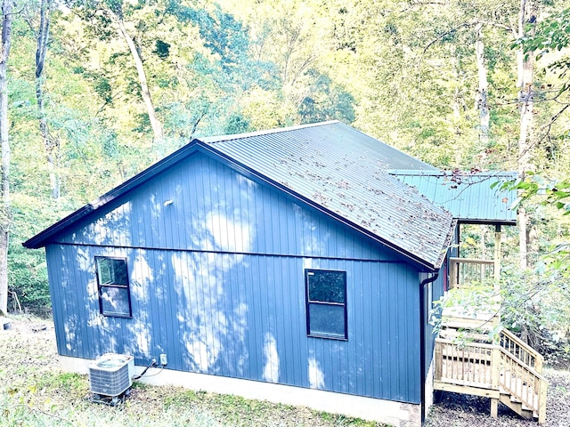 view of home's exterior with central AC unit