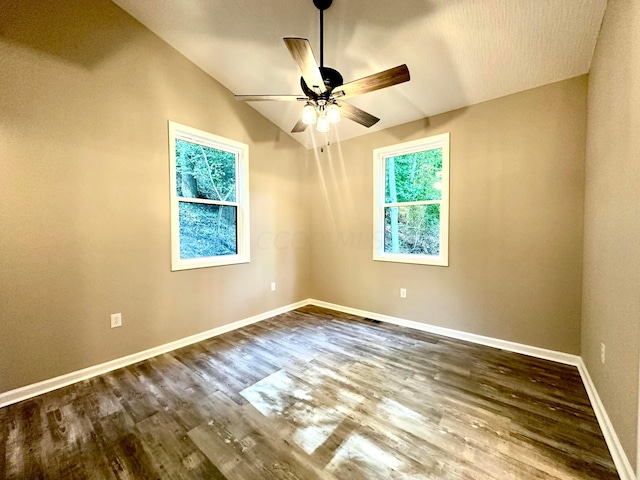 spare room featuring ceiling fan, hardwood / wood-style floors, and lofted ceiling