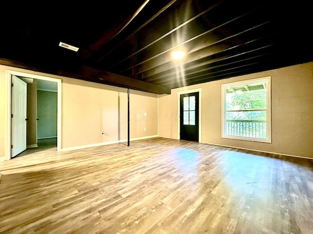 basement with hardwood / wood-style flooring