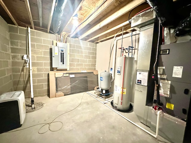 basement featuring electric panel and water heater