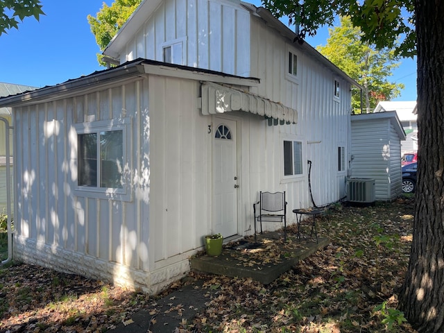 rear view of property with central air condition unit