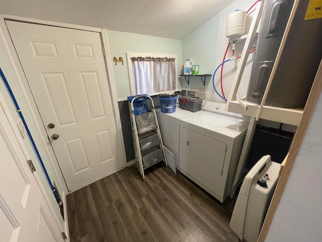 laundry area featuring independent washer and dryer and dark wood-type flooring