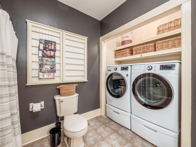 laundry area featuring separate washer and dryer and light tile patterned flooring