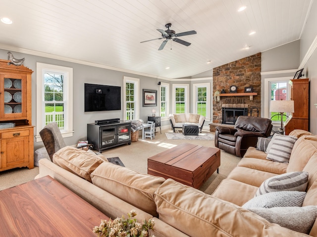 carpeted living room with lofted ceiling, a stone fireplace, crown molding, ceiling fan, and wood ceiling