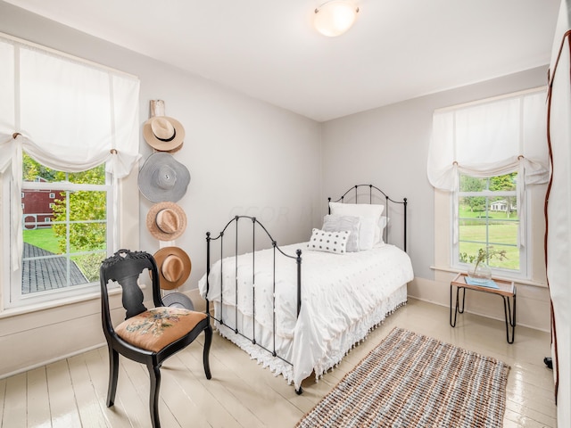 bedroom with hardwood / wood-style floors