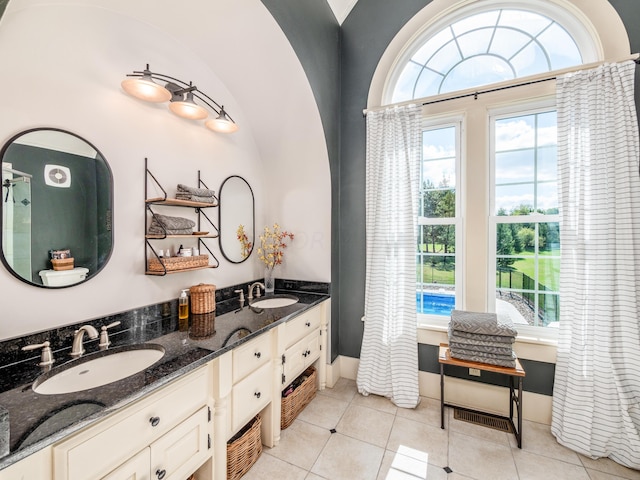 bathroom with tile patterned flooring and vanity