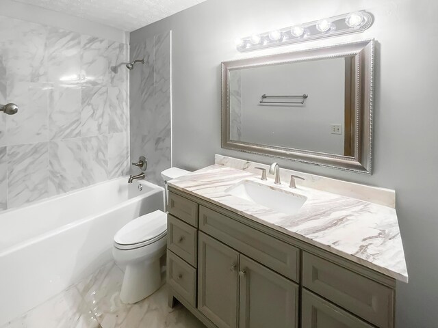 full bathroom featuring tiled shower / bath combo, toilet, a textured ceiling, and vanity