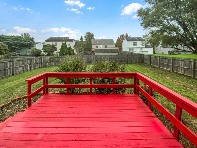 wooden deck with a lawn