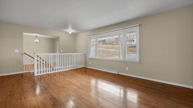 spare room featuring hardwood / wood-style floors