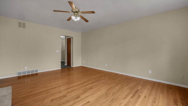 spare room featuring ceiling fan and light wood-type flooring