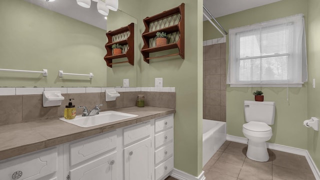 full bathroom with tasteful backsplash, tile patterned flooring, vanity,  shower combination, and toilet