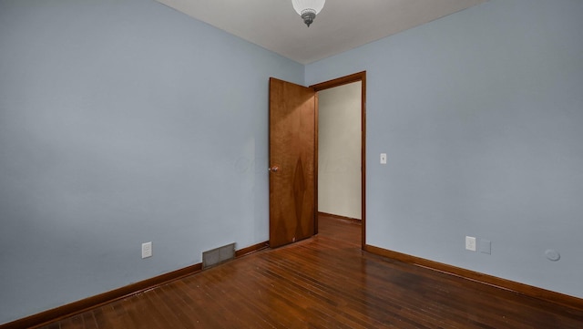 empty room featuring dark hardwood / wood-style floors