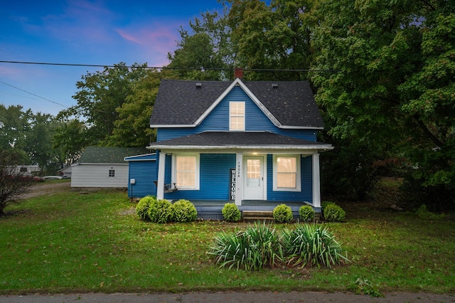 view of front of home featuring a porch and a lawn