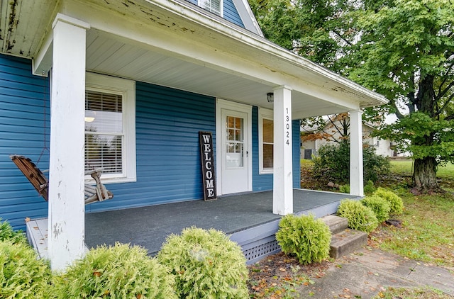 doorway to property featuring a porch