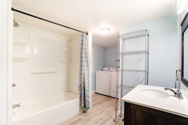 bathroom with vanity, wood-type flooring, washer and clothes dryer, and shower / bath combination with curtain