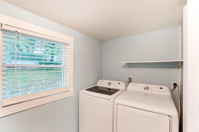 laundry area with washer and dryer and a healthy amount of sunlight