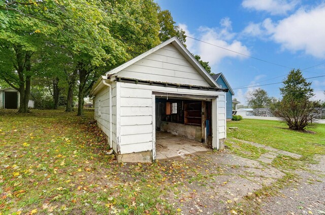 garage featuring a yard