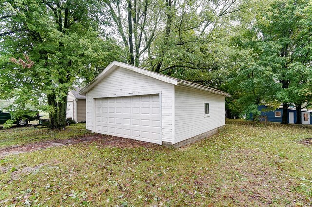 garage with a lawn