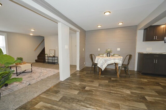 dining room featuring dark hardwood / wood-style flooring and ornamental molding