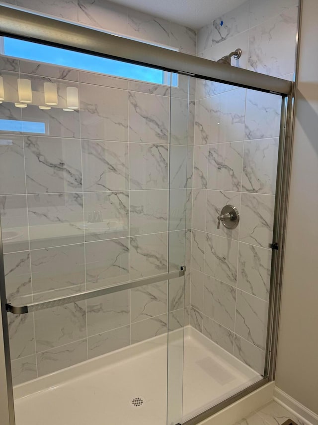 bathroom featuring walk in shower