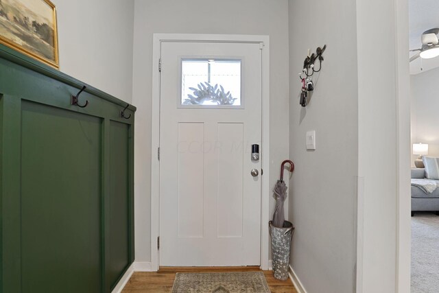 entrance foyer featuring hardwood / wood-style floors and ceiling fan