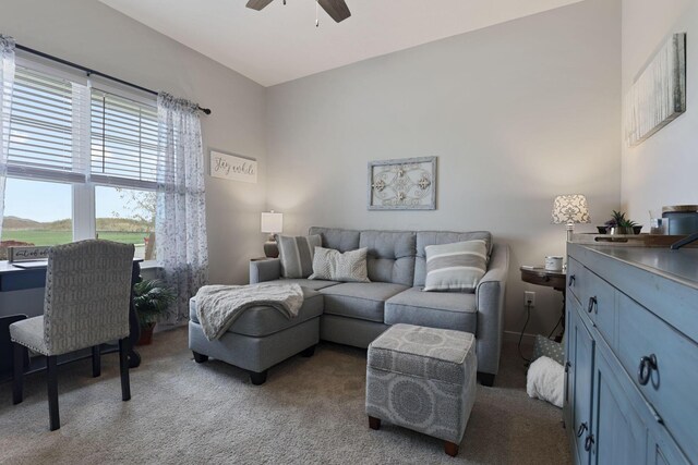 living room with ceiling fan and light colored carpet