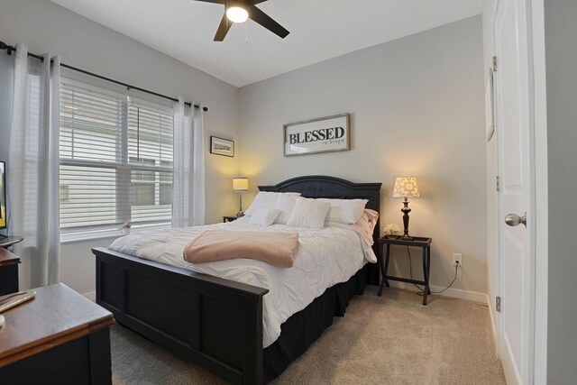 carpeted bedroom with ceiling fan