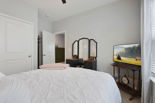 carpeted bedroom featuring ceiling fan