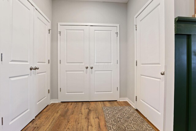 interior space with hardwood / wood-style floors and elevator