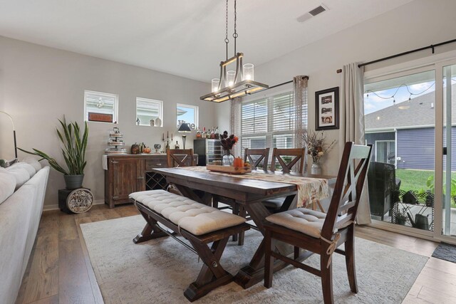 dining space with light hardwood / wood-style floors