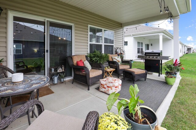 view of patio with an outdoor hangout area and grilling area