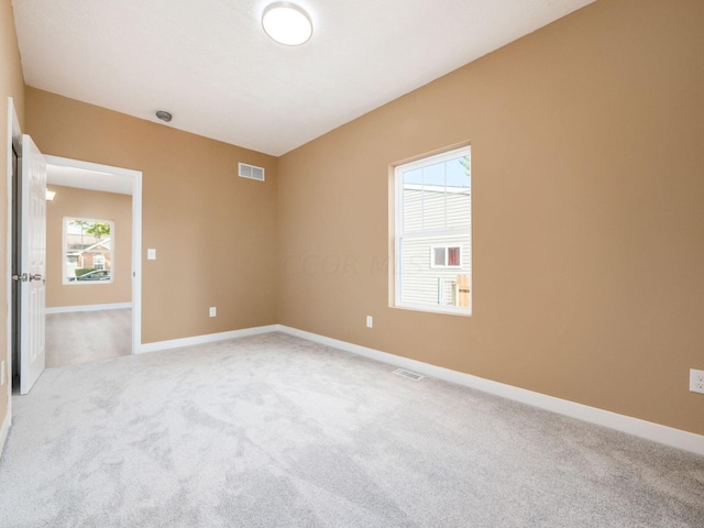 unfurnished room featuring carpet floors