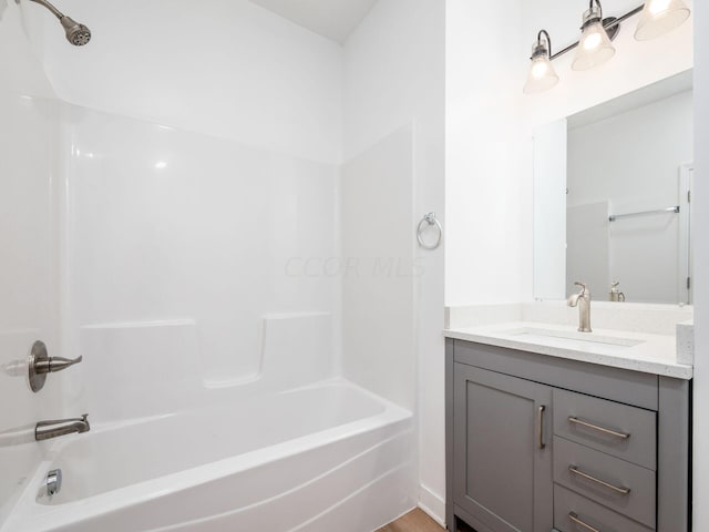 bathroom with vanity and tub / shower combination