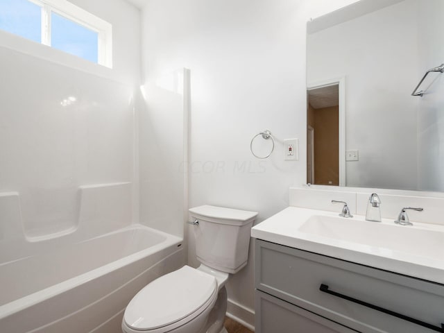 full bathroom featuring vanity,  shower combination, and toilet