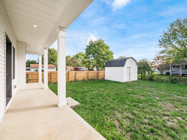 view of yard with a patio and a storage unit