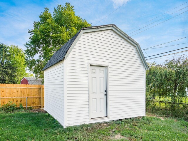 view of outdoor structure with a lawn