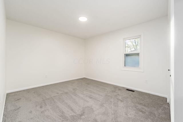 spare room with carpet floors