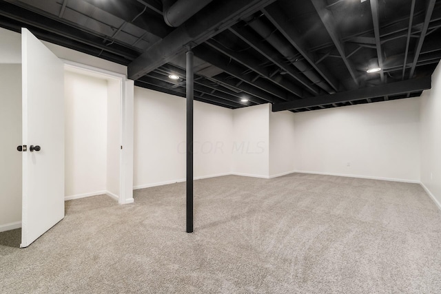 basement with carpet flooring