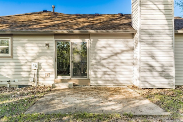 rear view of property featuring a patio area