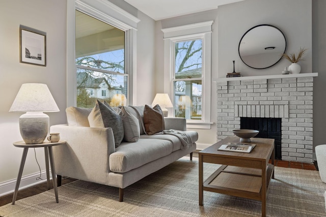 living room featuring a fireplace and plenty of natural light