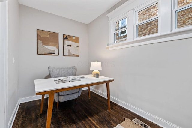 office with dark hardwood / wood-style flooring