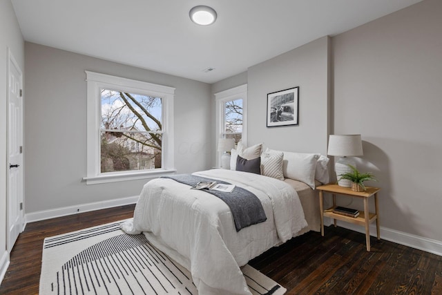 bedroom featuring dark hardwood / wood-style flooring