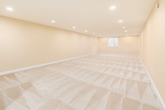 spare room with light carpet